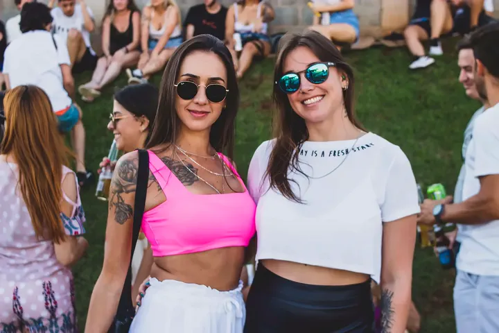 Two festival guests posing together for a portrait